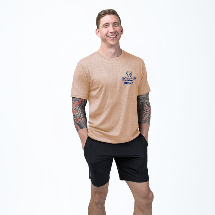 The REP Fitness Deadlift Party Tri-Blend Crew T-Shirt in Heather Peach/Blue on body