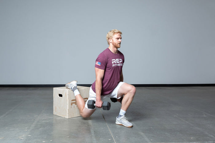 Lifter performing weighted split squats on an In-Between REP 3-in-1 Wood Plyo Box.