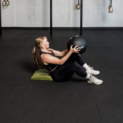Athlete using the REP Fitness Ab Support Mat 2.0