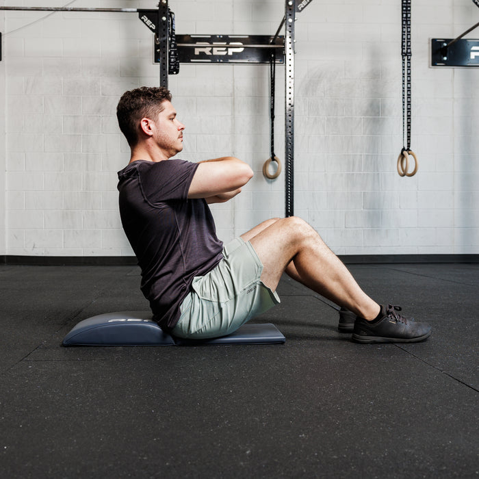 Athlete using the REP Fitness Ab Support Mat 2.0
