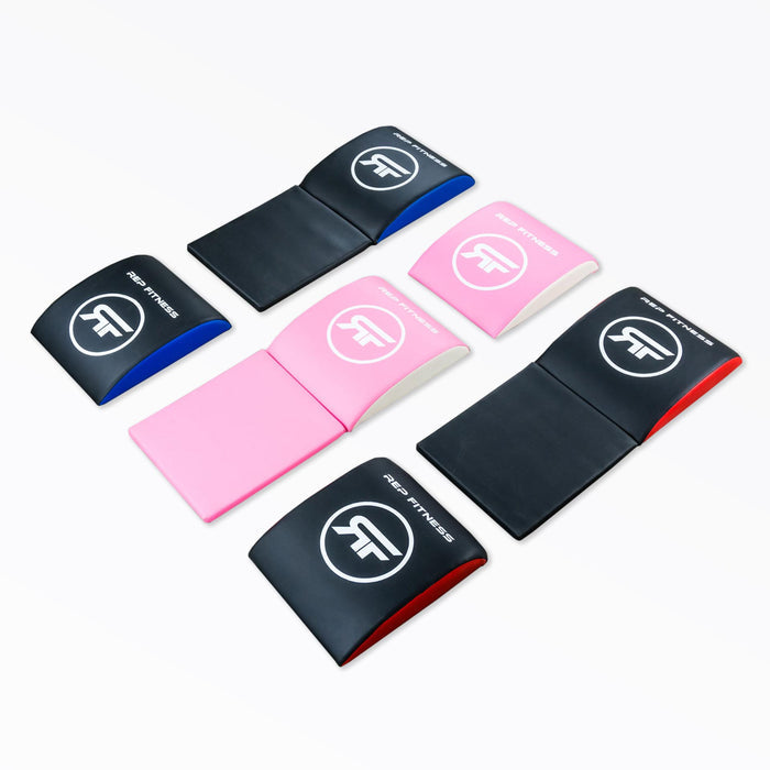 All six REP Ab Support Mat options laid out: Blue, Red, or Pink, each color with or without a tailbone protector.
