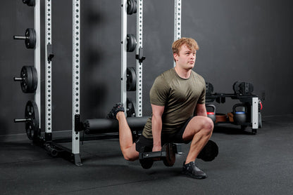 Athlete using the REP Fitness Altitude™ Leg Roller as a leg rest while doing dumbbell split squats