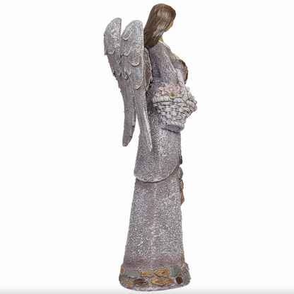 Statue of an angel holding a basket on a white background