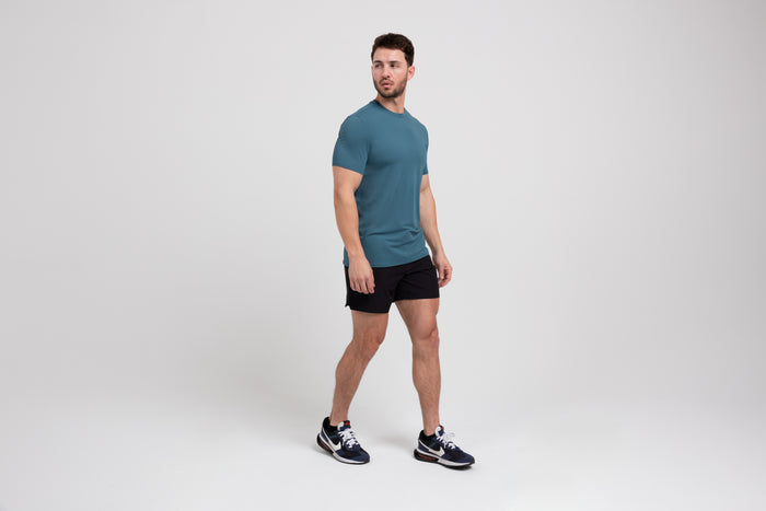 The REP Fitness Men's Delta Shirt in Slate front, walking