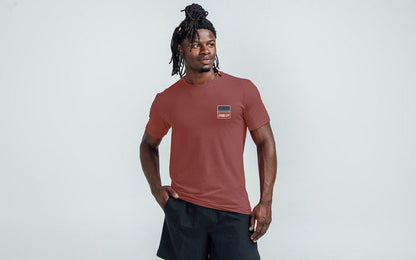 The REP Fitness Rise Tri-Blend Crew T-Shirt in Heather Russet/Blue front, on model