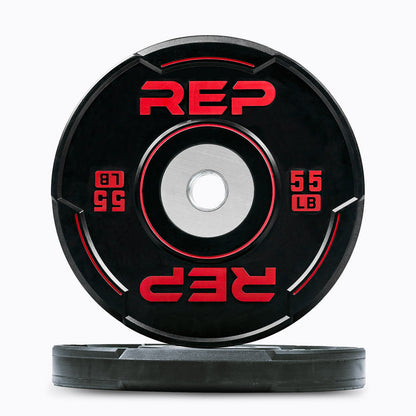 Studio-shot: Front and side profile of a red 55 lb REP Sport Bumper Plate 2.0 on a white background