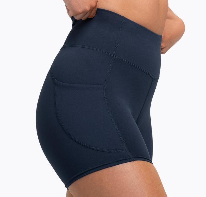 The REP Fitness Women's Forma Shorts in Navy on body, hip-crop view