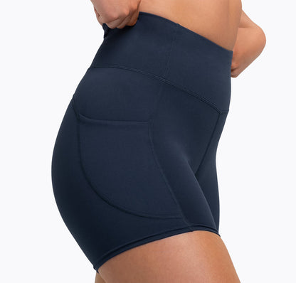 The REP Fitness Women's Forma Shorts in Navy on body, hip-crop view