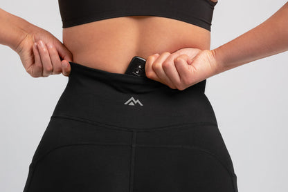 The REP Fitness Women's Forma Shorts in Black on body, waistband pocket detail