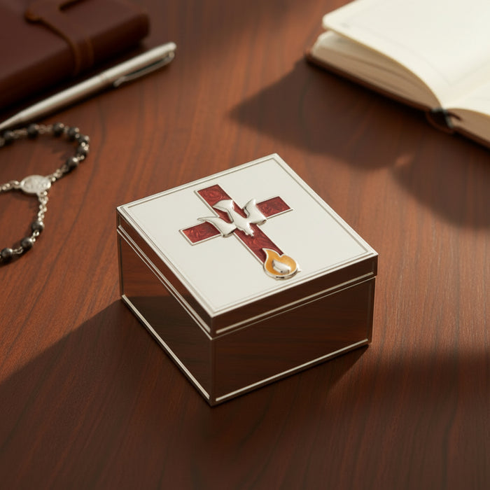 Hand opening a Confirmation jewelry box with a decorative cross emblem on a wooden surface.