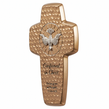 Gold cross with Holy Spirit dove emblem and engraved text on a white background