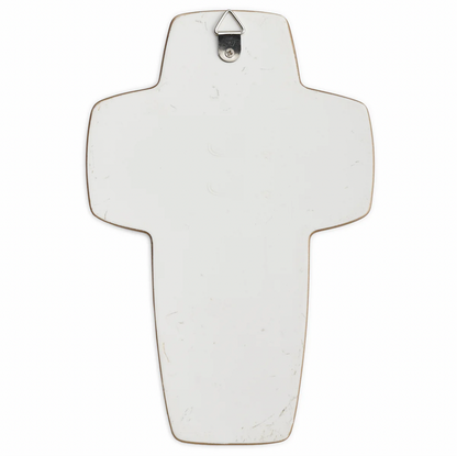 Decorative cross with a silver hook on a white background