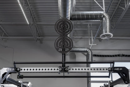 The REP Fitness Crossmember Mount Wall Ball Target on an 82 inch crossmember