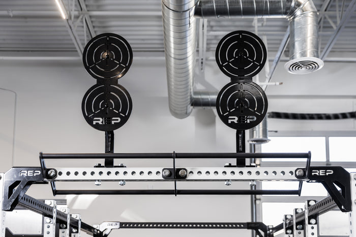 Two of the REP Fitness Crossmember Mount Wall Ball Targets on an 82 inch crossmember