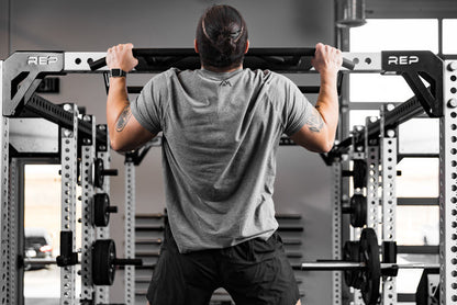 Athlete doing pull-ups on the Crossmember Multi-Grip Pull-Up Bar