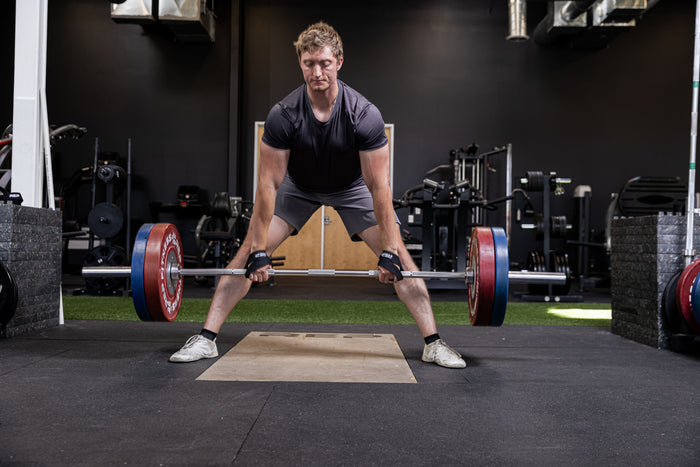 Athlete using the REP Fitness figure 8 lifting straps