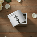 Silver First Holy Communion jewelry box on a wood surface