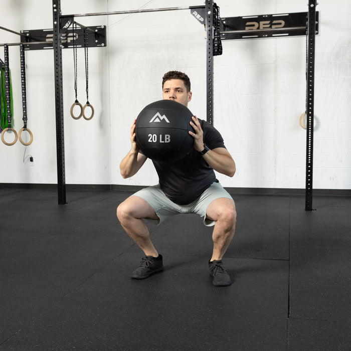 Athlete using the REP Fitness Medicine Balls 2.0