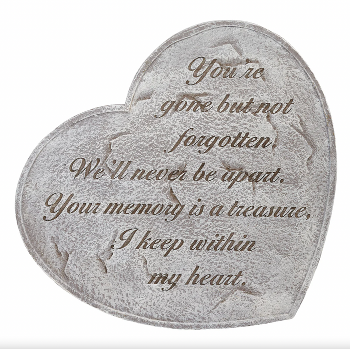Heart-shaped stone with engraved text on a white background