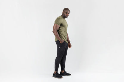 The REP Fitness Men's Apollo Joggers in Heather Black front, lifestyle 3/4 angle