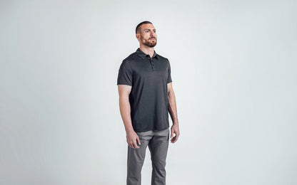 The REP Fitness Men's Audax Performance Polo in Heather Black/Cool Gray front, 3/4 angle