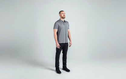 The REP Fitness Men's Audax Performance Polo in Heather Cool Gray/Black front, 3/4 angle