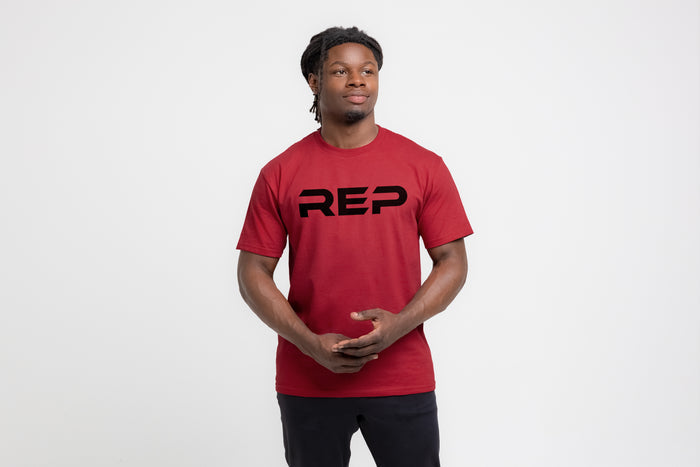 The REP Fitness Men's Bulk Up Heavyweight Crew T-Shirt in Red/Black front, on model
