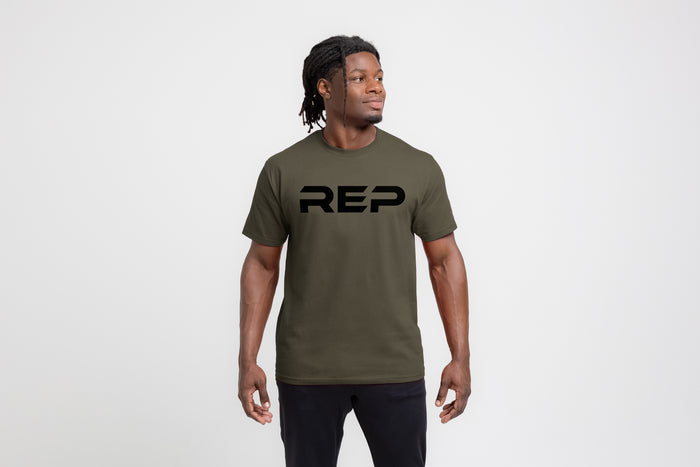 The REP Fitness Men's Bulk Up Heavyweight Crew T-Shirt in Olive/Black front, on model