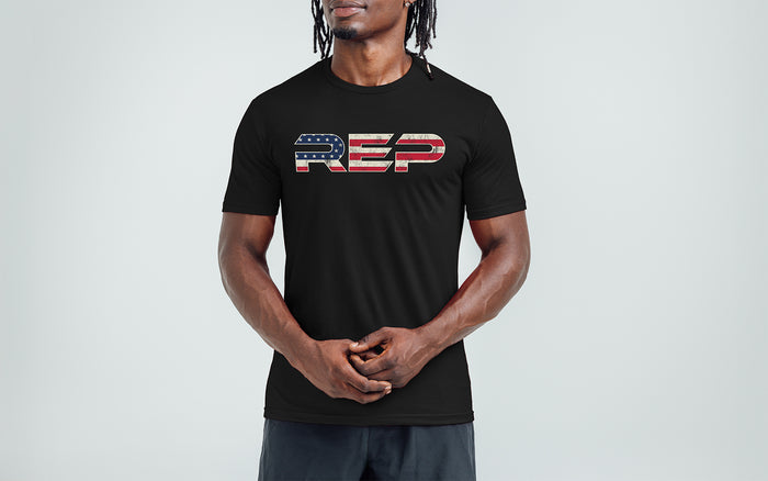 The REP Fitness Men's Daily Driver 2.0 USA Tri-Blend Crew T-Shirt in Heather Black/White front, on model