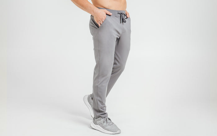 The REP Fitness Men's Felix Pants in Cool Gray on body, side view