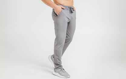 The REP Fitness Men's Felix Pants in Cool Gray on body, side view