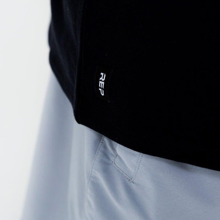 The REP Fitness Men's Magnis Heavyweight T-Shirt in Black front hem detail