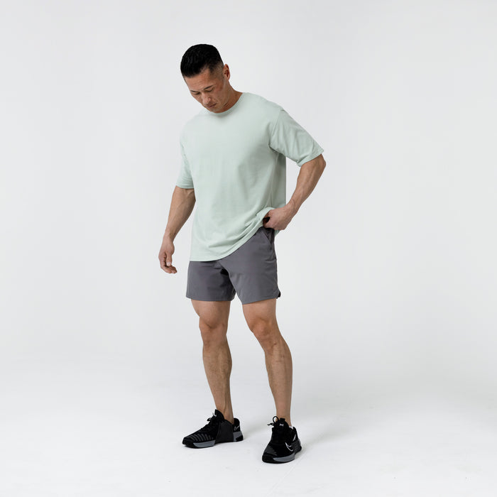 The REP Fitness Men's Magnis Heavyweight T-Shirt in Aqua Gray side on body shot