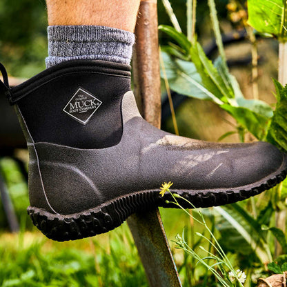 M2A000 Muckster II Men's Ankle  Muck boot worn by a person in a garden setting
