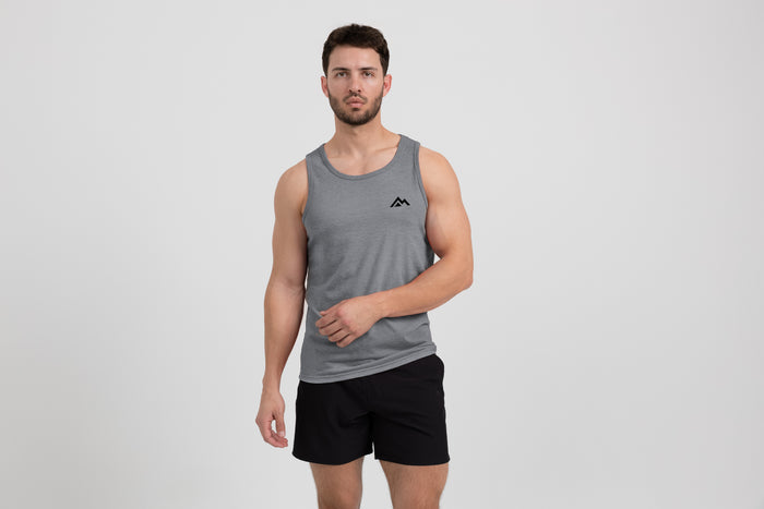 The REP Fitness Men's Peak Tri-Blend Tank in Heather Aluminum/Black front, on model