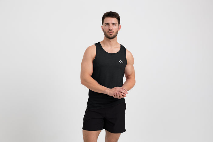 The REP Fitness Men's Peak Tri-Blend Tank in Heather Black/White front, on model