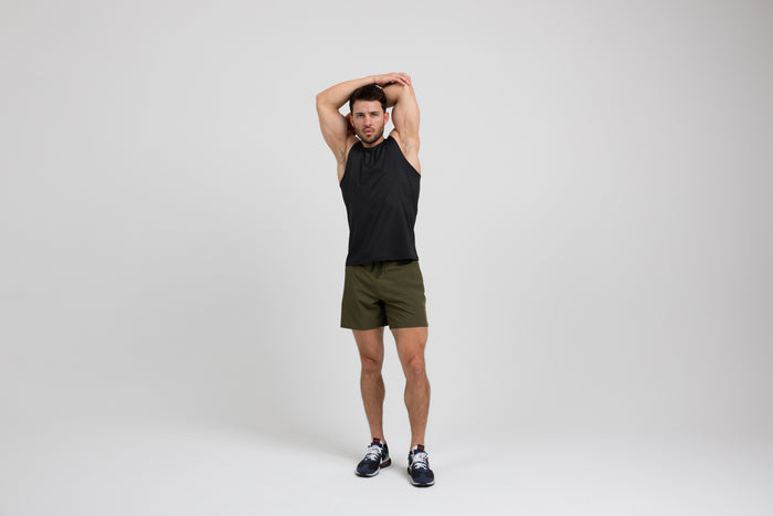 The REP Fitness Men's Solis Muscle Tee in Black front, arms overhead stretch