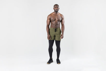 The REP Fitness Men's Virtus Light Compression Tights in Black front, worn under shorts