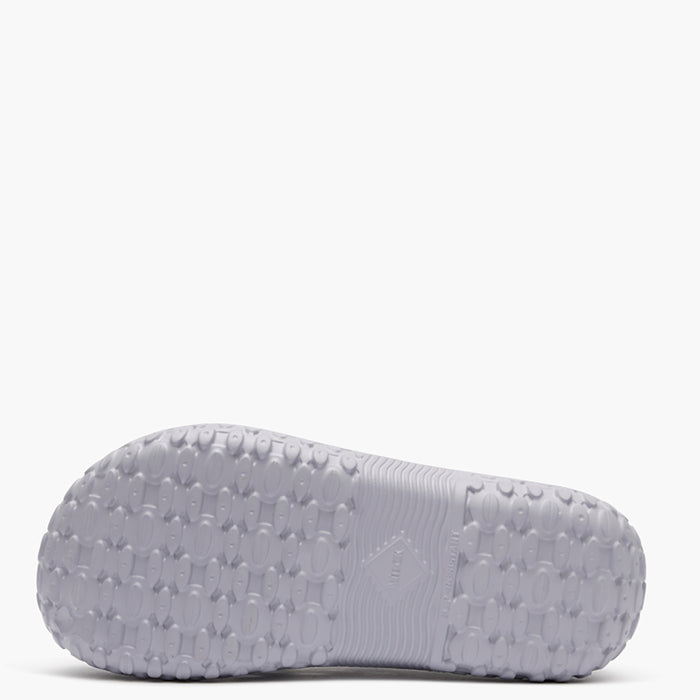Gray sandal sole with textured pattern on a white background