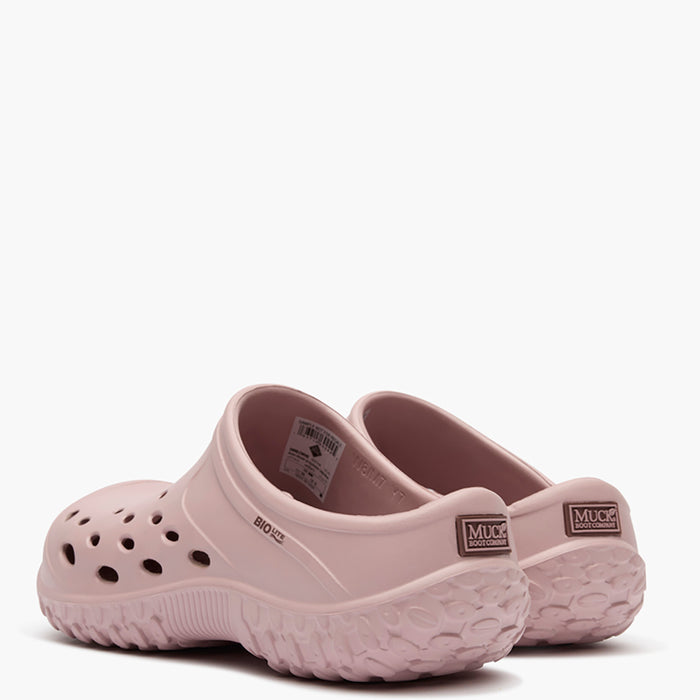 Pair of beige clogs on a white background