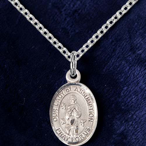 Silver 'Our Lady of Assumption' pendant on a chain against a dark blue background