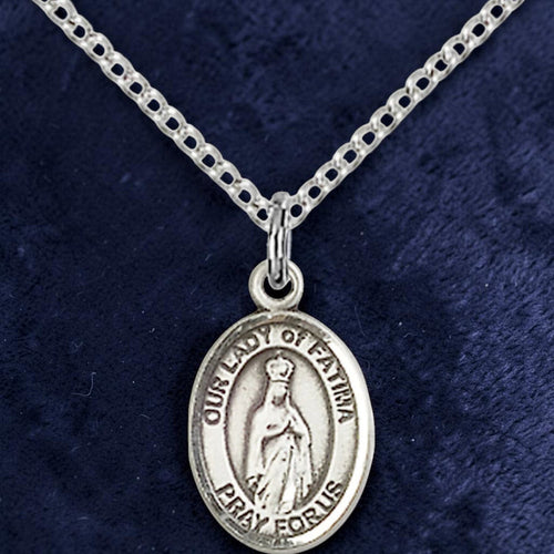 Silver necklace with a pendant on a dark blue background