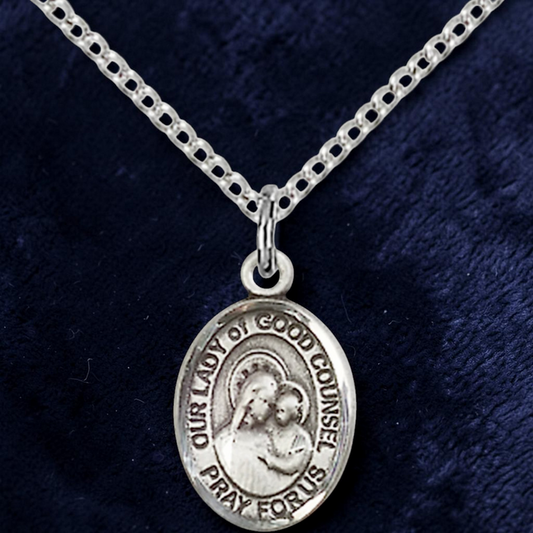 Silver necklace with a pendant on a dark blue background