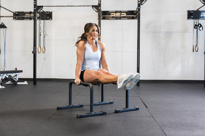 Athlete doing an L-Sit on the REP Fitness Parallette Bars