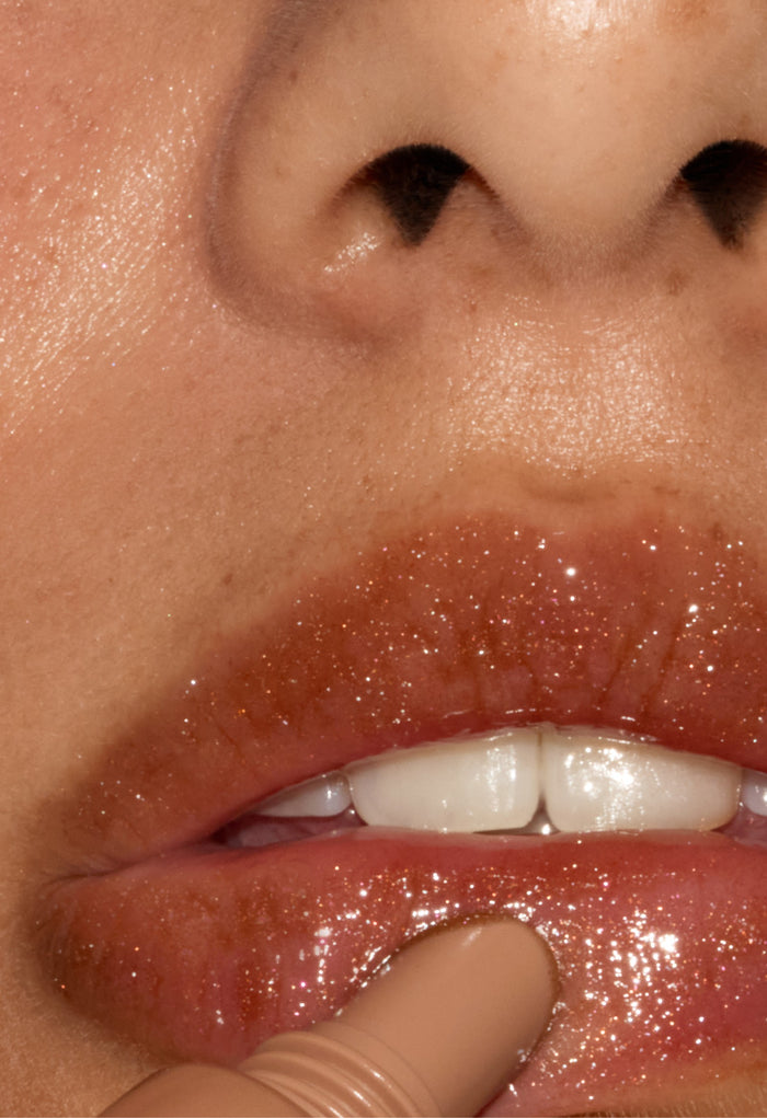 model wearing peptide lip tint sweet apple