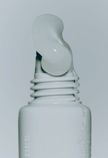 closeup of rhode peptide lip treatment (unscented) with product squeezing out