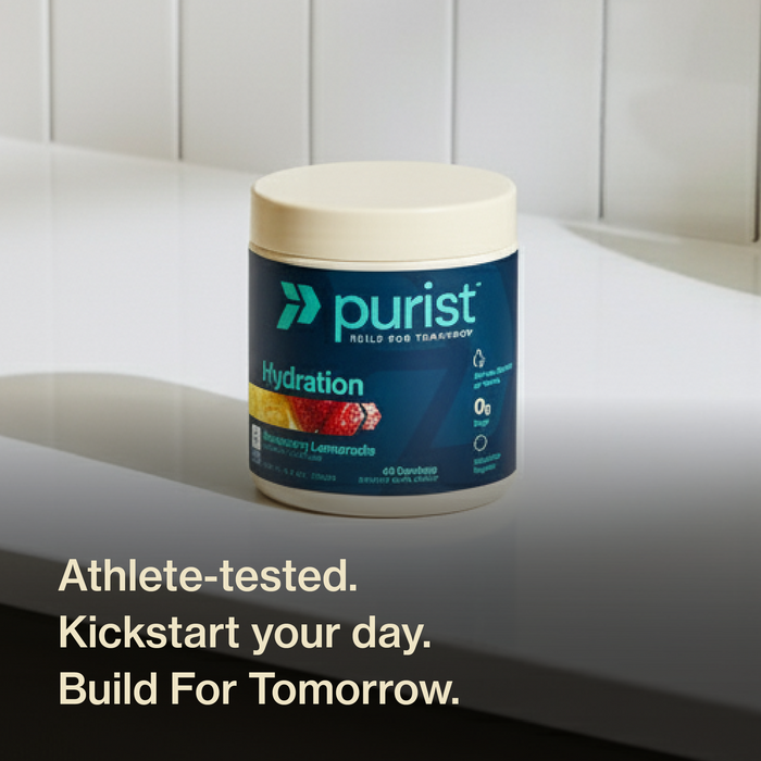 Purist Hydration container on a white surface with promotional text. Athlete tested. Kickstart your day. Build for tomorrow.