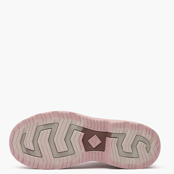 Close-up of a pink athletic shoe sole on a white background