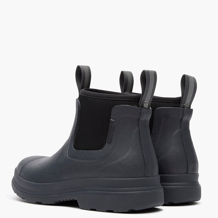 Black rubber boots with elastic sides on a white background