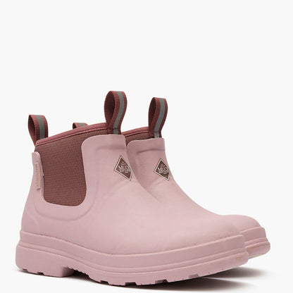 Pair of pink rubber boots with brown accents on a white background